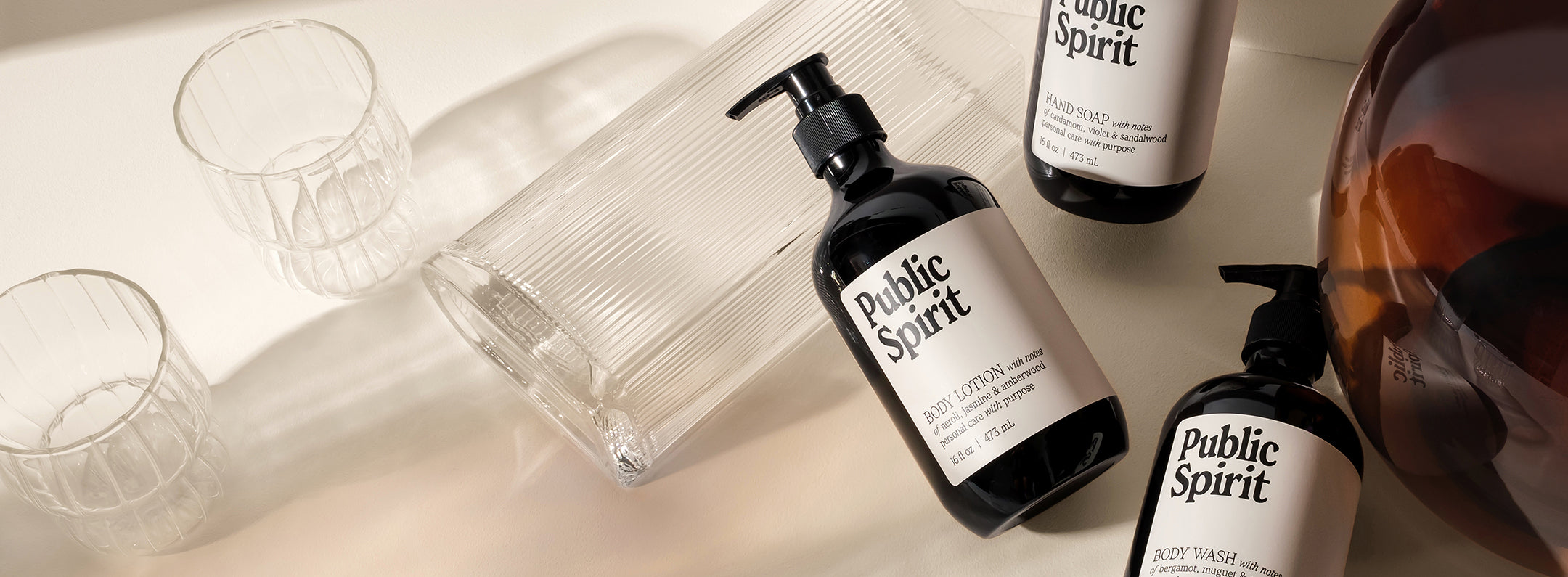 Public Spirit Hand Soap, Body Wash and Body Lotion scattered around